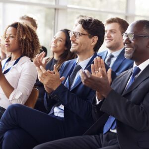 smiling audience applauding at a business seminar PLQAUXK.jpg